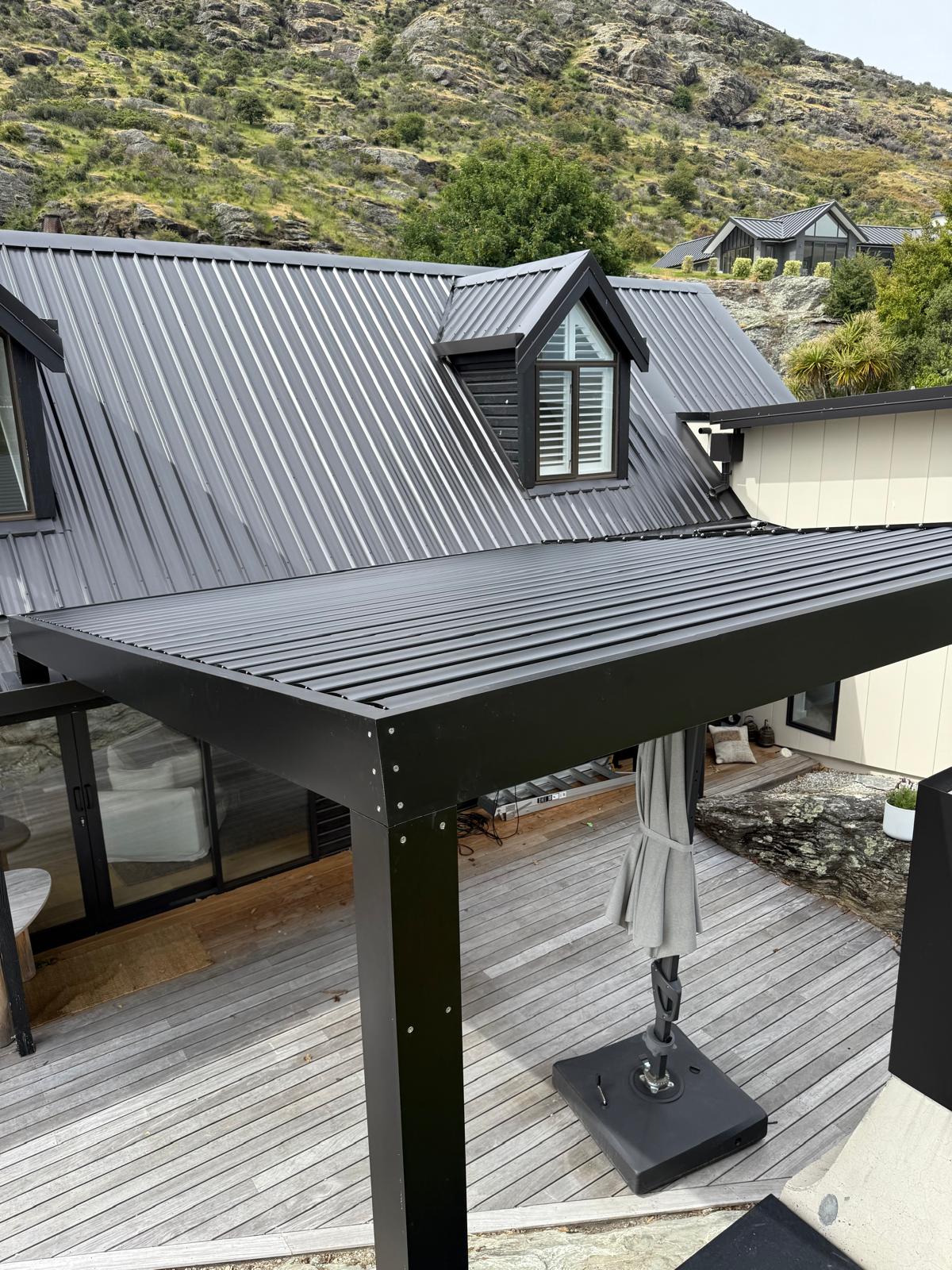 Close-up of a black aluminium louvre roof in Queenstown