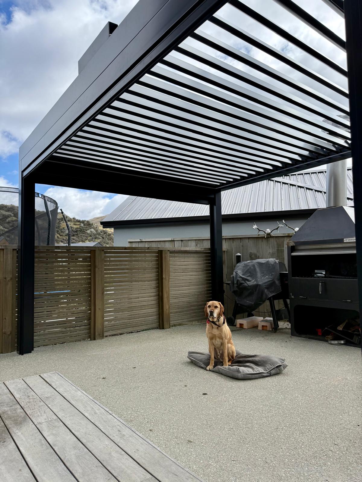 Open black louvre roof over a patio in Queenstown